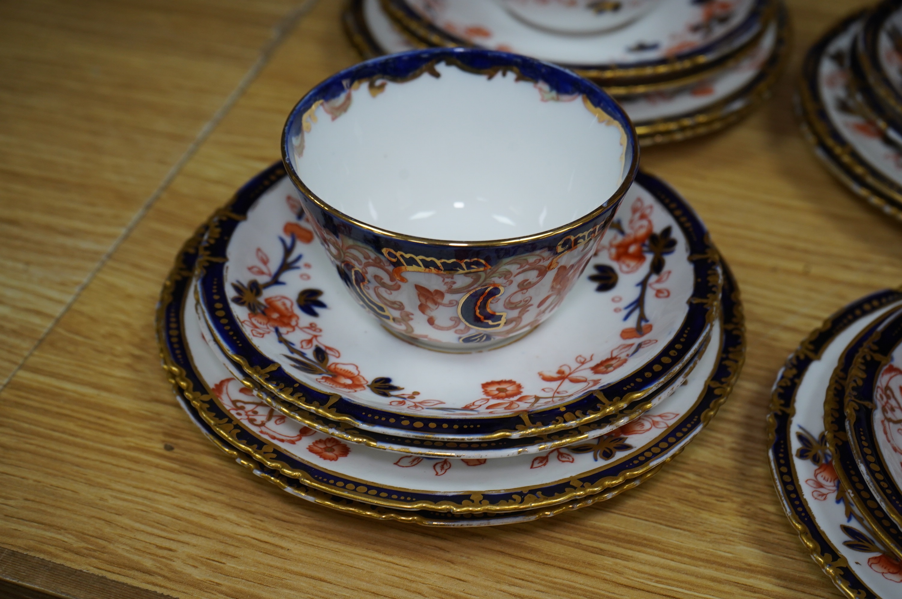 A Royal Crown Derby Imari porcelain part tea set to include sandwich plates, trios and milk jug. Condition - varies, some breaks